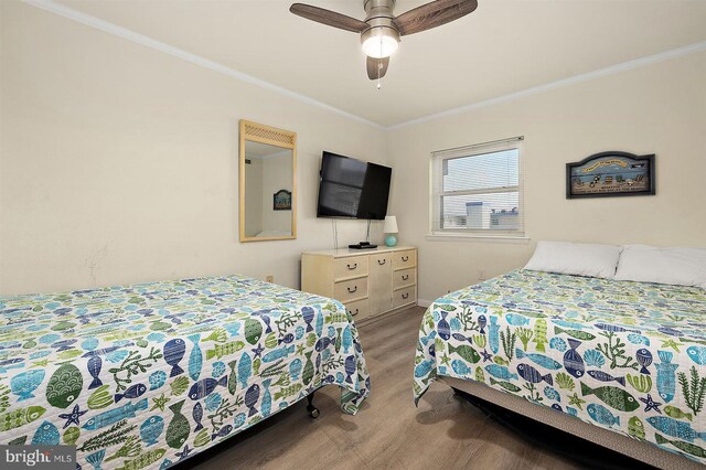3801 Atlantic Ave Unit 517, Ocean City, MD 21842 - bedroom with ornamental molding, baseboards, and ceiling fan