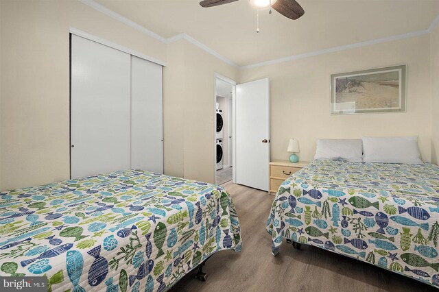 3801 Atlantic Ave Unit 517, Ocean City, MD 21842 - bedroom with light wood-type flooring, a closet, ornamental molding, and a ceiling fan