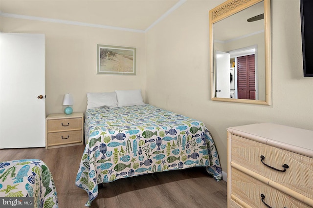 3801 Atlantic Ave Unit 517, Ocean City, MD 21842 - bedroom featuring crown molding, dark wood finished floors, and washer / clothes dryer