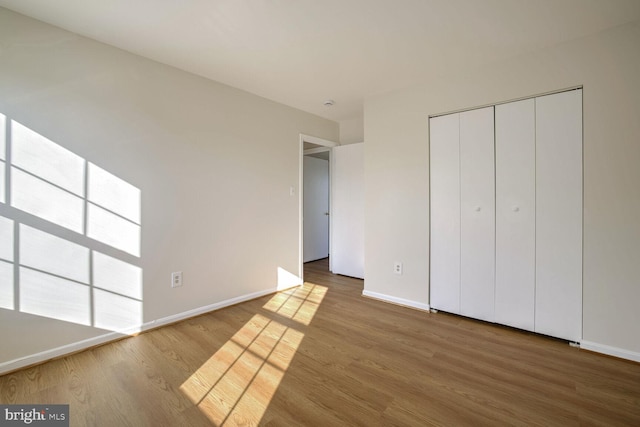 1 Ridge Heights Ct, Gaithersburg, MD 20879 - unfurnished bedroom with baseboards, wood finished floors, and a closet