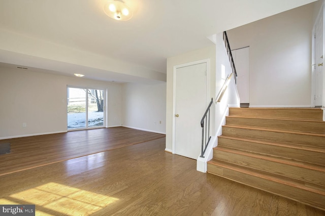 1 Ridge Heights Ct, Gaithersburg, MD 20879 - staircase featuring wood finished floors and baseboards