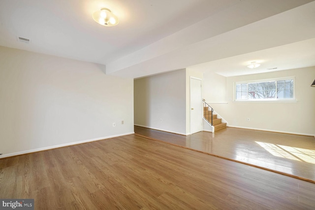 1 Ridge Heights Ct, Gaithersburg, MD 20879 - spare room featuring wood finished floors, baseboards, and stairway