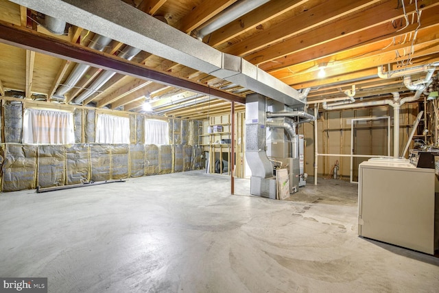 1 Ridge Heights Ct, Gaithersburg, MD 20879 - below grade area featuring washer / clothes dryer, heating unit, and water heater