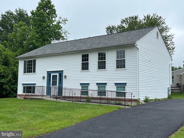 1 Ridge Heights Ct, Gaithersburg, MD 20879 - bi-level home featuring a front yard, a chimney, and a shingled roof