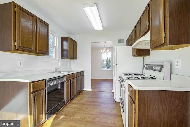 1 Ridge Heights Ct, Gaithersburg, MD 20879 - kitchen featuring dishwasher, white gas range, a sink, light wood-style floors, and a chandelier