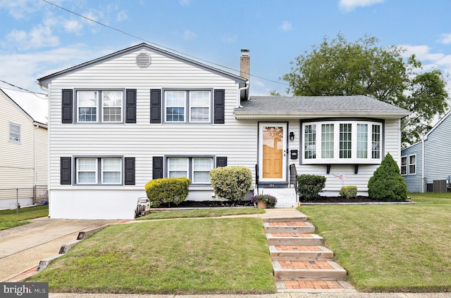 355 Maple Ave, Gloucester City, NJ 08030 - tri-level home with a chimney and a front lawn
