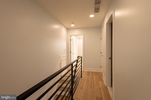 2039 S Cleveland St, Philadelphia, PA 19145 - hallway featuring light wood-style flooring, recessed lighting, and an upstairs landing