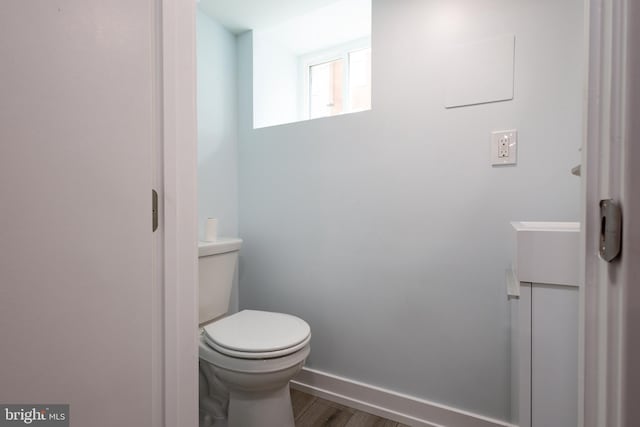 2039 S Cleveland St, Philadelphia, PA 19145 - bathroom with wood finished floors, toilet, and baseboards
