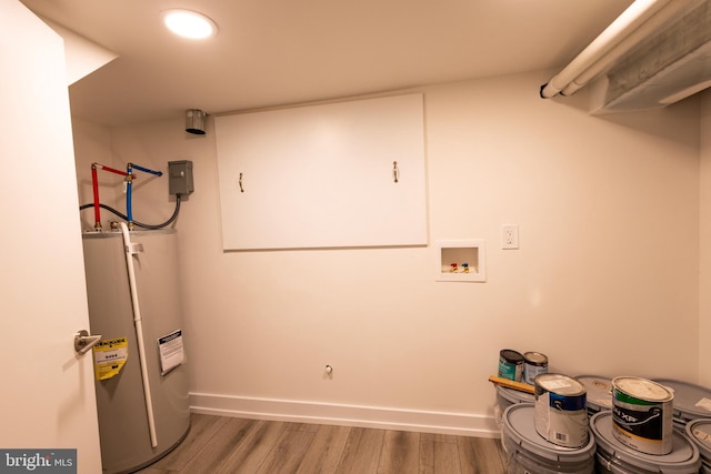 2039 S Cleveland St, Philadelphia, PA 19145 - laundry room with water heater, washer hookup, wood finished floors, and baseboards