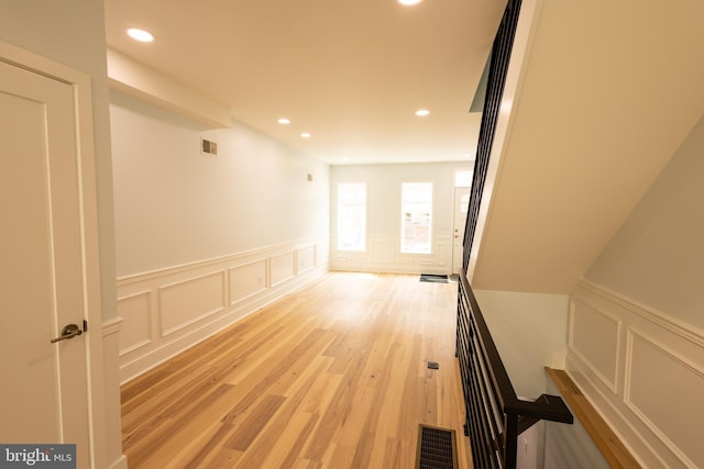 2039 S Cleveland St, Philadelphia, PA 19145 - hall with a decorative wall, wainscoting, recessed lighting, and light wood-type flooring