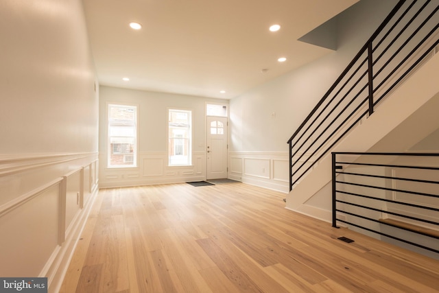 2039 S Cleveland St, Philadelphia, PA 19145 - entrance foyer featuring a decorative wall, wainscoting, light wood finished floors, recessed lighting, and stairs