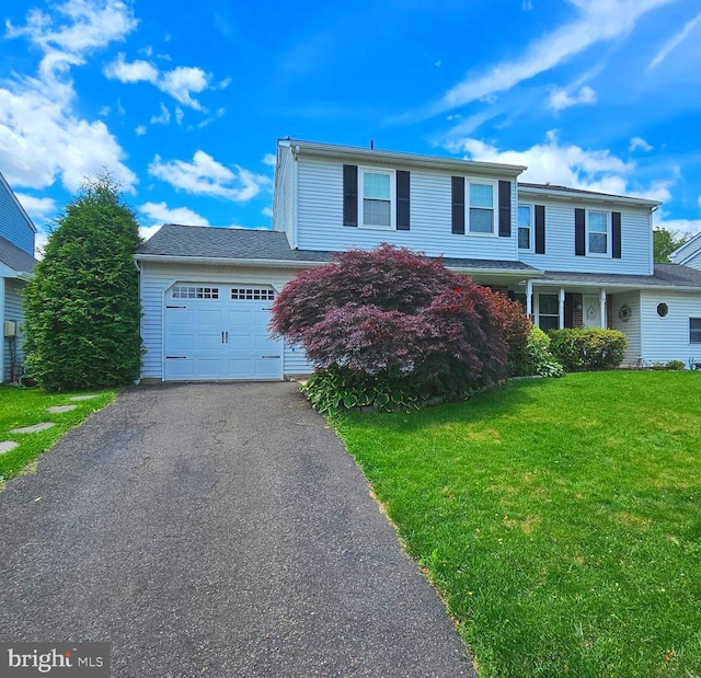 14 Curry Ln, Horsham, PA 19044 - traditional-style house featuring an attached garage, driveway, and a front yard