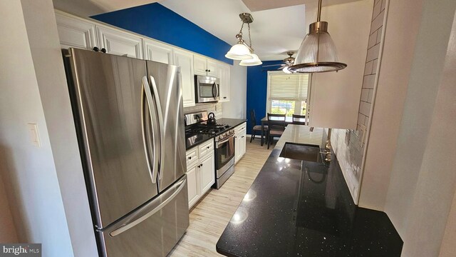 14 Curry Ln, Horsham, PA 19044 - kitchen featuring stainless steel appliances, a sink, decorative backsplash, light wood finished floors, and ceiling fan