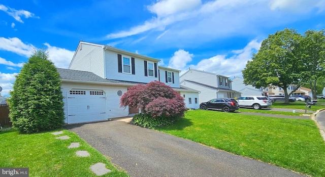 14 Curry Ln, Horsham, PA 19044 - view of front of house featuring a front yard, an attached garage, and asphalt driveway