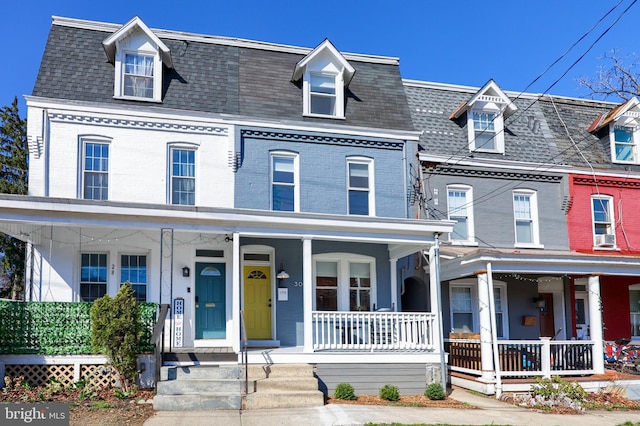 30 N Marshall St, Lancaster, PA 17602 - townhome / multi-family property featuring a porch, brick siding, and roof with shingles