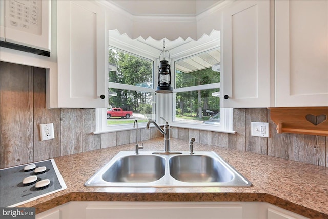 1803 Dubs Church Rd, Hanover, PA 17331 - kitchen with a sink, white cabinetry, backsplash, black electric cooktop, and light countertops