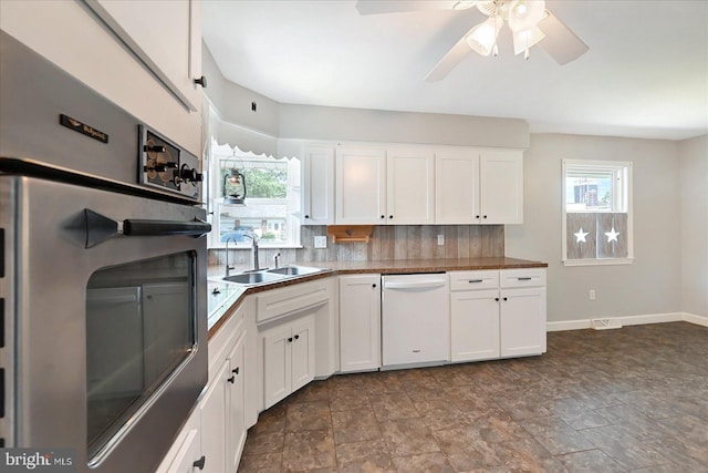 1803 Dubs Church Rd, Hanover, PA 17331 - kitchen featuring white dishwasher, a sink, tasteful backsplash, and white cabinets