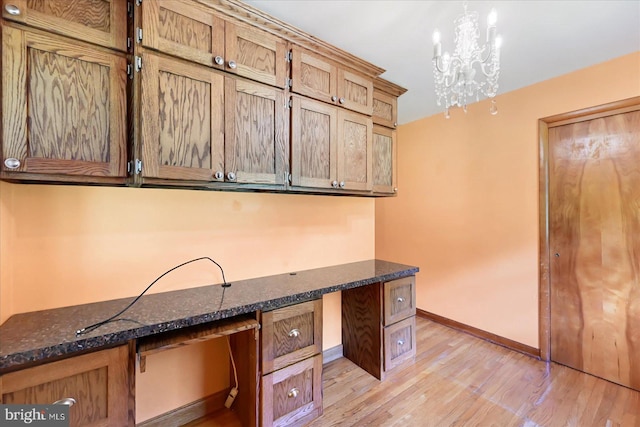 1803 Dubs Church Rd, Hanover, PA 17331 - unfurnished office featuring built in desk, light wood finished floors, baseboards, and a chandelier