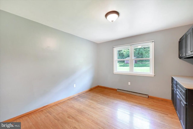 1803 Dubs Church Rd, Hanover, PA 17331 - kitchen featuring a baseboard heating unit, light wood-style floors, baseboards, and light countertops