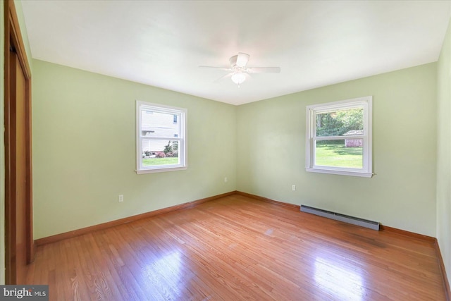 1803 Dubs Church Rd, Hanover, PA 17331 - unfurnished room featuring a baseboard heating unit, ceiling fan, wood finished floors, and baseboards