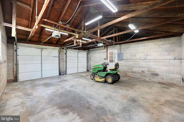 1803 Dubs Church Rd, Hanover, PA 17331 - garage featuring electric panel, a garage door opener, and concrete block wall