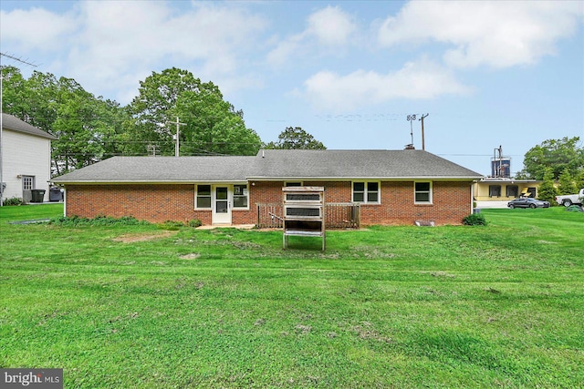 1803 Dubs Church Rd, Hanover, PA 17331 - rear view of property with a lawn, brick siding, and a wooden deck