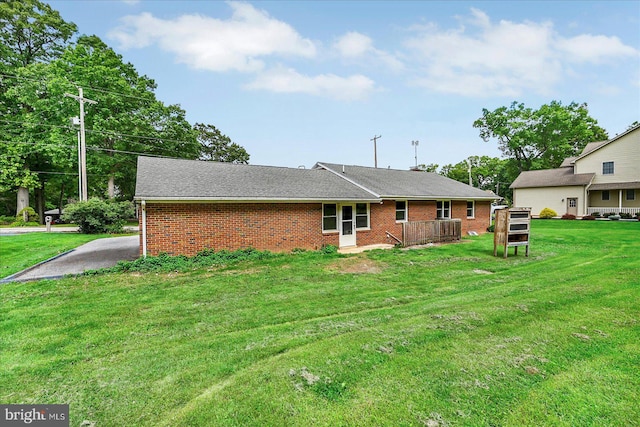 1803 Dubs Church Rd, Hanover, PA 17331 - rear view of house featuring brick siding and a lawn