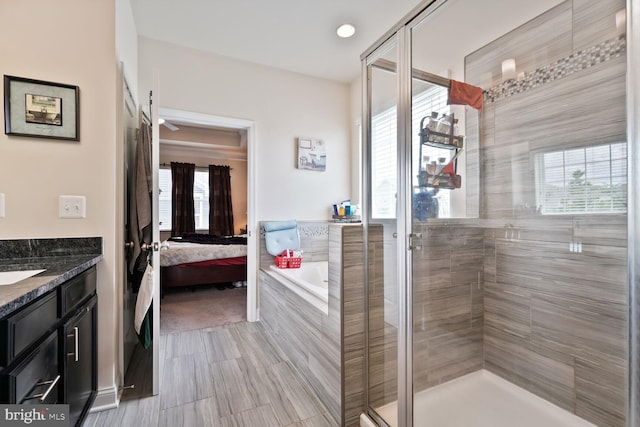 5544 Old Colony Ct, White Plains, MD 20695 - ensuite bathroom with a bath, a stall shower, and vanity