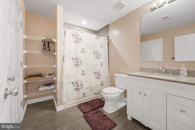 5544 Old Colony Ct, White Plains, MD 20695 - bathroom featuring vanity, toilet, baseboards, wood finished floors, and recessed lighting