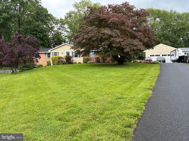 2303 Fife Ct, Forest Hill, MD 21050 - view of front facade with a front yard and a detached garage