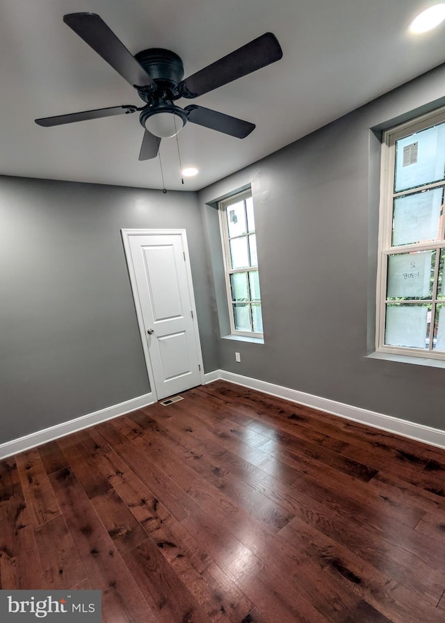 1512 W Pratt St, Baltimore, MD 21223 - unfurnished room with dark wood finished floors, baseboards, and ceiling fan