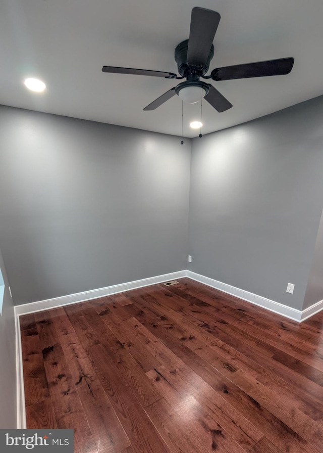 1512 W Pratt St, Baltimore, MD 21223 - unfurnished room featuring dark wood-style floors, baseboards, a ceiling fan, and recessed lighting