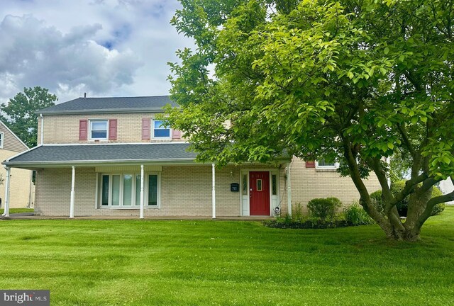 713 Worthington Dr, Warminster, PA 18974 - view of front of property with a front lawn, brick siding, and a shingled roof