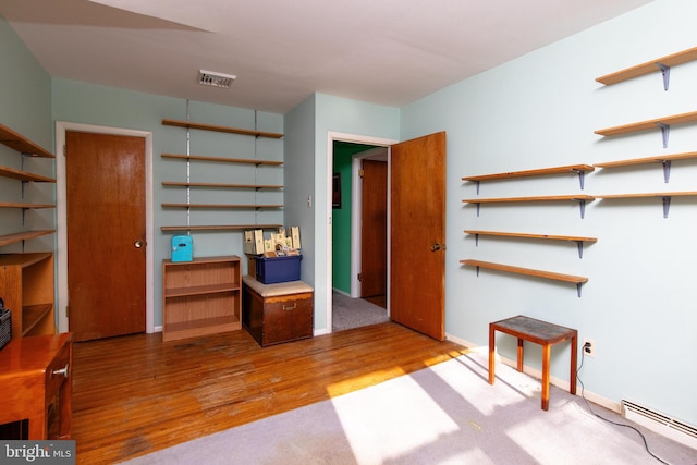 713 Worthington Dr, Warminster, PA 18974 - interior space with baseboard heating, wood finished floors, and baseboards