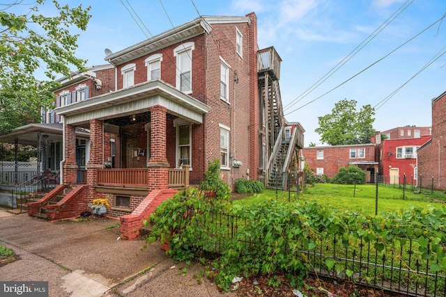 236 N Charlotte St, Pottstown, PA 19464 - multi unit property featuring stairs, brick siding, and covered porch