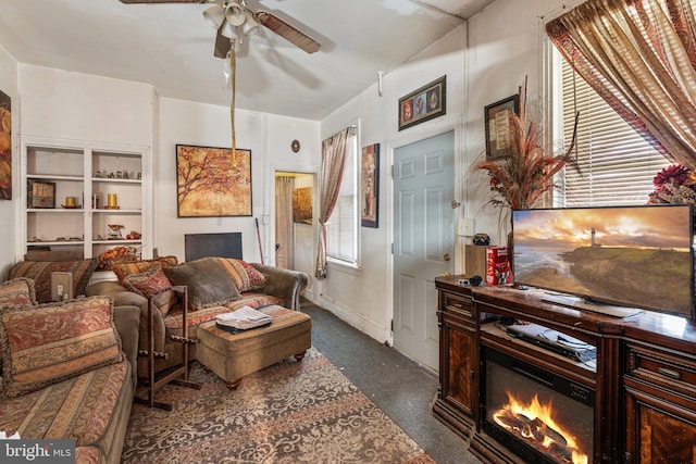 236 N Charlotte St, Pottstown, PA 19464 - living room with ceiling fan and a warm lit fireplace