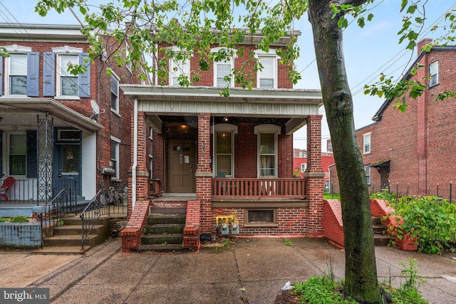 236 N Charlotte St, Pottstown, PA 19464 - view of property with a porch and brick siding