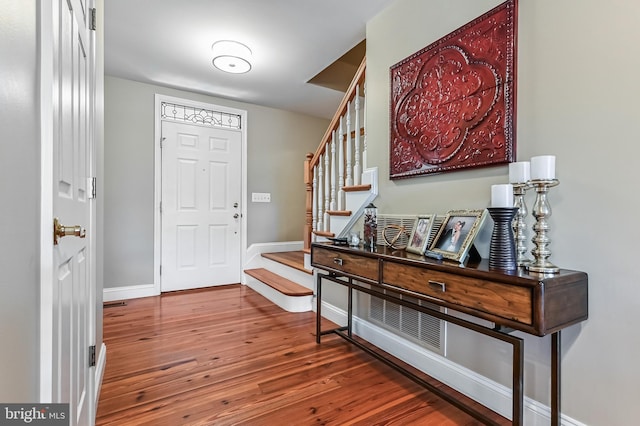 205 Mallard Dr, Stevensville, MD 21666 - entryway featuring wood finished floors, stairs, and baseboards