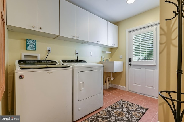 205 Mallard Dr, Stevensville, MD 21666 - washroom with washer and dryer, light tile patterned flooring, cabinet space, and baseboards
