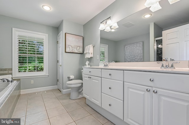 205 Mallard Dr, Stevensville, MD 21666 - bathroom with double vanity, tile patterned flooring, toilet, a bath, and baseboards