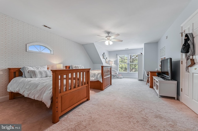 205 Mallard Dr, Stevensville, MD 21666 - carpeted bedroom with wallpapered walls, a ceiling fan, baseboards, and an accent wall