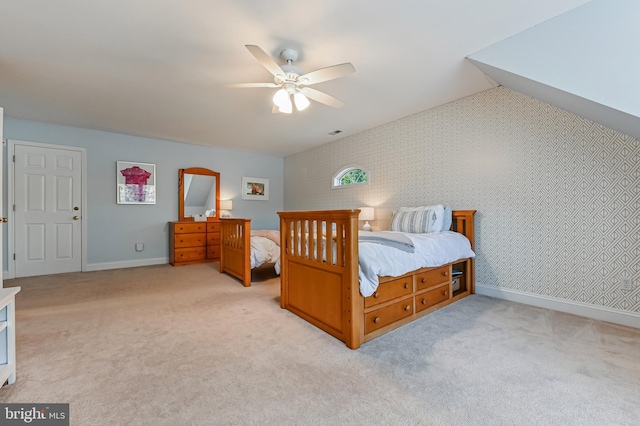 205 Mallard Dr, Stevensville, MD 21666 - bedroom featuring light carpet, a ceiling fan, baseboards, and wallpapered walls