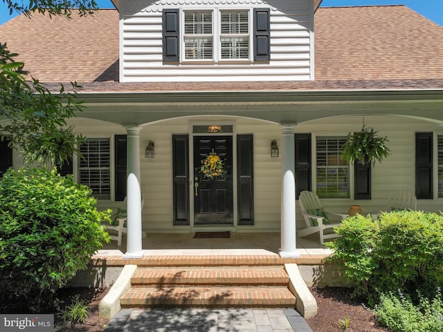 205 Mallard Dr, Stevensville, MD 21666 - entrance to property with covered porch and a shingled roof