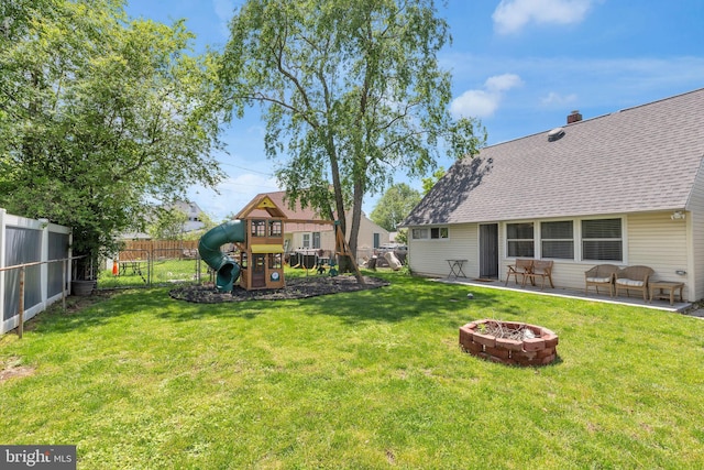 15 Wildflower Rd, Levittown, PA 19057 - view of yard featuring a playground, an outdoor fire pit, and a patio