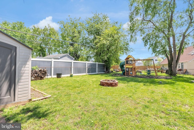 15 Wildflower Rd, Levittown, PA 19057 - view of yard featuring a playground and an outdoor fire pit
