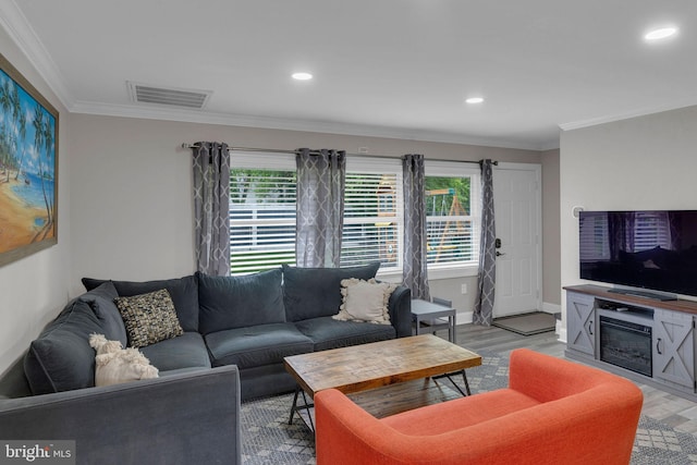 15 Wildflower Rd, Levittown, PA 19057 - living room with healthy amount of natural light, light wood-style flooring, crown molding, recessed lighting, and baseboards