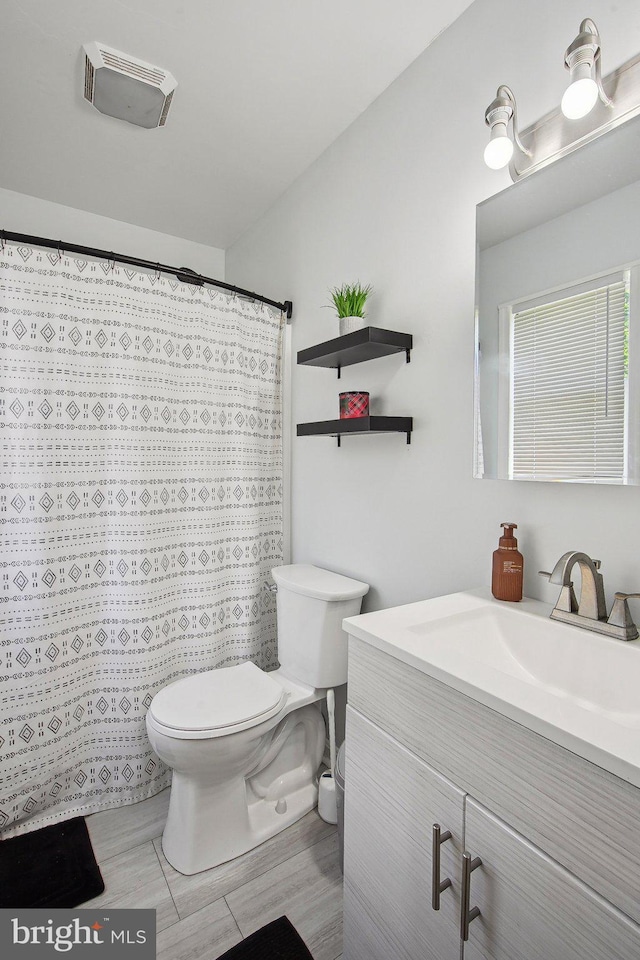 1838 Sherman Dr, Chester, MD 21619 - full bathroom with toilet, vanity, and a shower with shower curtain