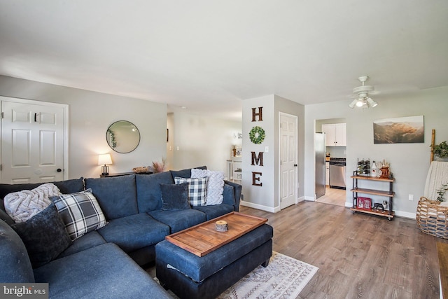1838 Sherman Dr, Chester, MD 21619 - living room featuring ceiling fan, light wood-style flooring, and baseboards