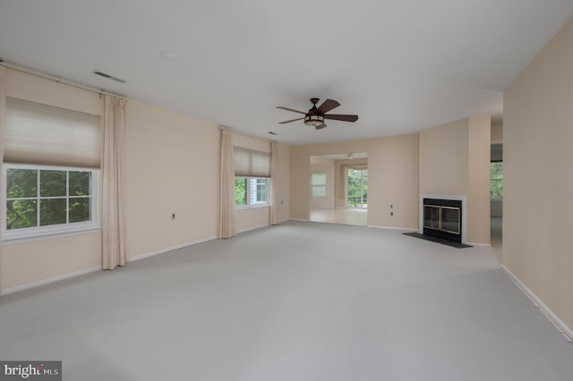 5 Keswick Ct, Mount Laurel, NJ 08054 - unfurnished living room featuring ceiling fan, a fireplace with flush hearth, carpet floors, and baseboards