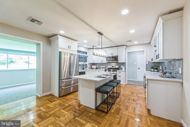 44 S Brookside Rd, Springfield, PA 19064 - kitchen with stainless steel appliances, baseboards, light countertops, backsplash, and recessed lighting